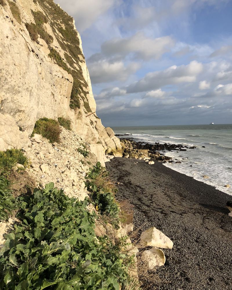White chalk cliffs above a pebble beach at Dover