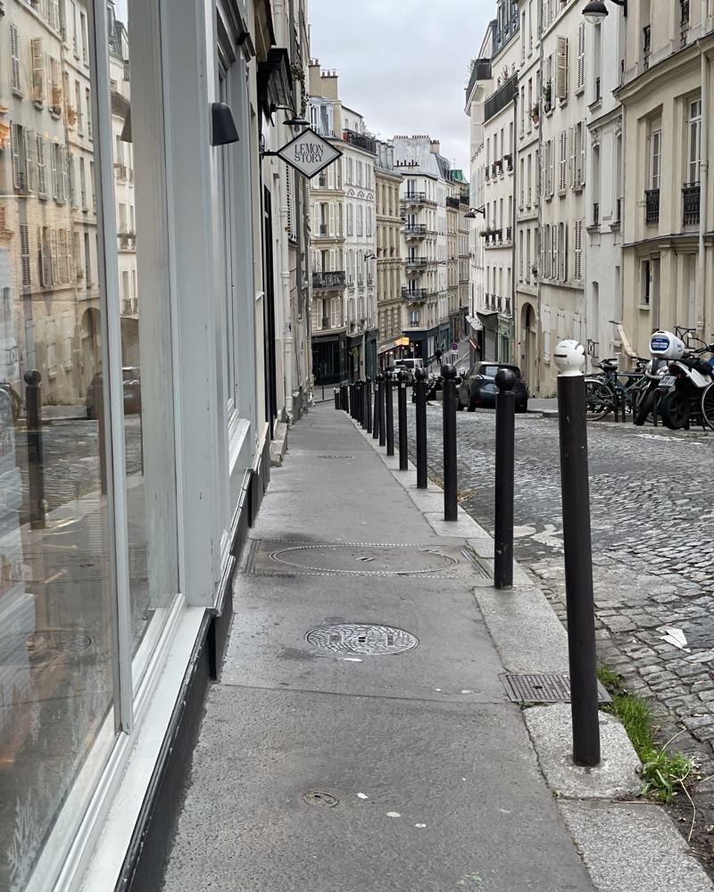 A quiet cobbled street in Paris in the morning