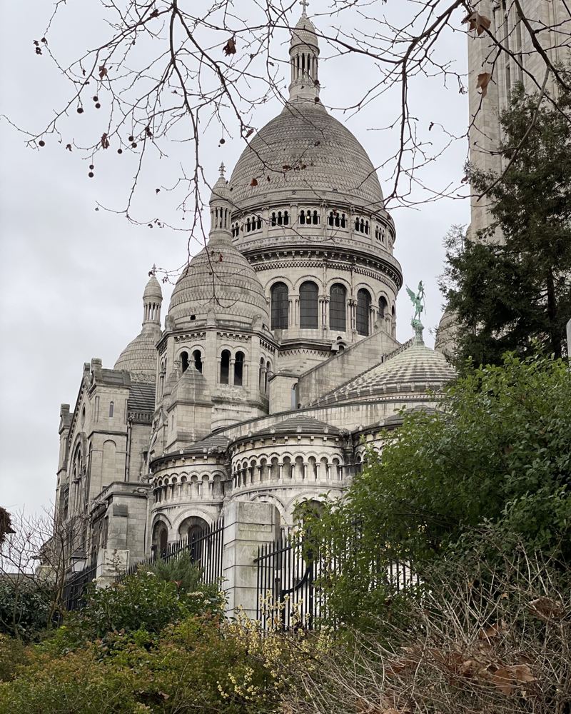Sacré-Cœur seen through bare winter trees